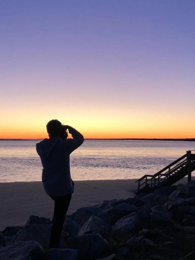 Photographing at dusk by the sea